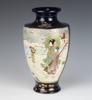 An early 20th Century Satsuma oviform vase, the blue ground decorated with figures in a snowy landscape and panels of flowers 30cm 