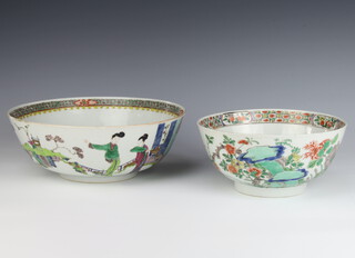 A 19th Century famille verte bowl decorated with scrolling flowers 20cm, ditto decorated figures in pavillion gardens 26cm 