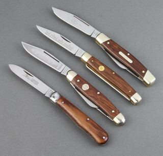 A Brooker Trade Brand Classic folding knife with 3 blades 8cm, 4.5cm and 4cm, the 8cm blade marked Tree Brand Classic 6066 Brooker Solingen Germany with wooden grip together with a J Henckels 3 bladed folding knife 7cm and 4cm, the 7cm blade marked Henckel Solingen 1731 Inox  and with wooden grip, a folding knife with 7cm blade marked Loewen Messer C Lutter & Cie with wooden grip and a 998 Puma Bird hunter folding knife with hook, the 8cm blade marked Handmade 998 Stainless Super Clean Cutting Steel Puma Germany 