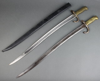 A French chassepot bayonet with plain 56cm blade, crossbar marked RH22153 complete with scabbard (corroded blade and dents to scabbard), together with 1 other chassepot bayonet, the crossbar marked L83039 
