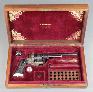 A mid 19th century cased 9mm Belgian pinfire 6 shot revolver by Lefaucheux signed on the breech "E. LEFAUCHEUX INVR. BREVETE" serial number 76417 and stamped a crown, the ebony and ivory grip carved floral motif with the same style engraved on the barrel and frame.  The red plush lined mahogany case comprising cleaning rod, turn screw, steel oil bottle, cylindrical box with turned horn lid for spare nipples and also fitted a wooden 24 round ammunition tray.  In good working order