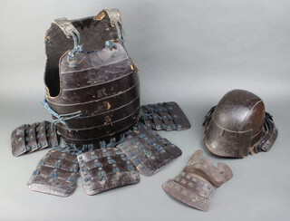 A Do breast plate and Kabuto chin guard of a Mengu, the back of the breast plate has a signature 