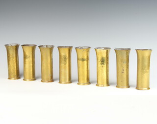 A set of 8 Keswick Arts & Crafts planished brass beakers, the bases marked SKI Keswick A404 14cm x 5cm 