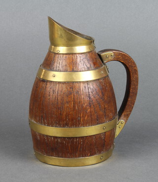 An oak and brass coopered jug 18cm x 10cm 
