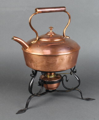 A Victorian square circular copper kettle 20cm x 20cm, raised on an associated wrought iron stand 