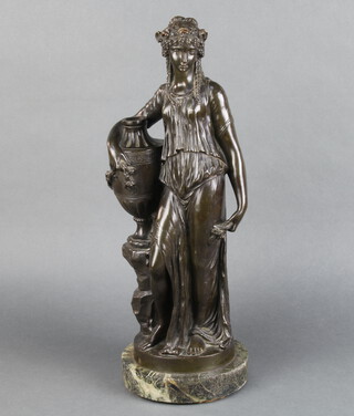 After Clodion, a classical bronze figure of a standing lady beside an urn, raised on a circular veined marble base 59cm h x 17cm diam. 