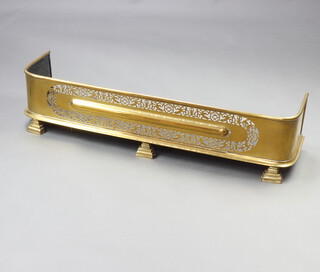 A Victorian pierced brass fender 23cm h x 97cm w x 15cm d 