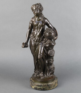 After Clodion, a bronze figure of classical standing lady with goblet, fruit and urn, on a circular marble base 50cm h x 17cm diam. 