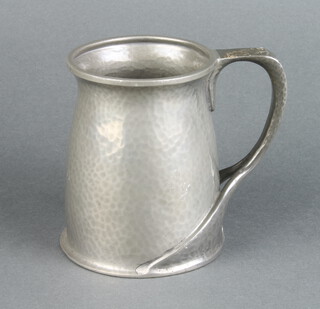 Oliver Baker for Liberty & Co., a Tudric planished pewter tankard, the base marked Made in England Tudric Pewter 066 11.5cm x 9.5cm diam. 