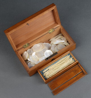 Twenty one 19th Century mother of pearl playing counters in the form of fish, a rectangular ditto and 73 circular ditto (3 chipped to the rims), contained in a rectangular mahogany box with hinged lid together with 30 various Victorian bone jack straws in a box with sliding lid (lid f) 