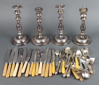 A set of 4 silver plated candlesticks 28cm and minor cutlery 