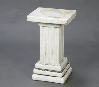A rectangular white veined marble column, raised on a rectangular fluted marble column with square stepped base, 49cm h x 30cm w x 26cm d (in 5 sections) 