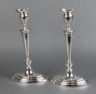 A pair of silver plated Adam style oval candlesticks, retailed by Harrods 30cm 