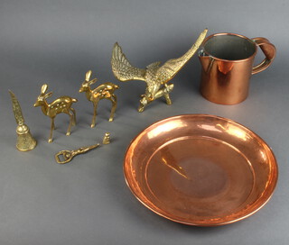 A copper jug 14cm x 13cm, a circular copper dish 4cm x 32cm, a brass figure of an eagle with wings outstretched 26cm h x 29cm w x 12cm d, 2 brass figures of deer, a brass table bell, a Crown cork bottle opener and a small brass figure of an owl 