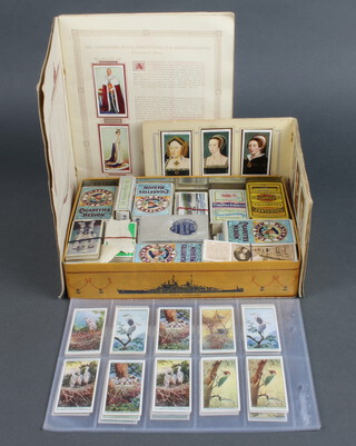 A collection of loose cigarette cards including Players, Geoffrey Phillips, Guerreras, Players albums of cigarette cards - King George V and Queen Elizabeth Coronation and 1 other Kings and Queens of England 1066 to 1935   