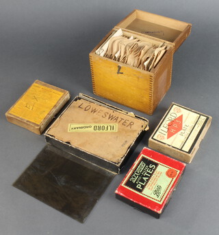 A collection of glass photographic slides contained in a wooden box 8cm x 10cm, a collection of glass photographic slides in a cardboard box marked Loweswater 12cm x 16cm, 3 further boxes of glass photographic slides 8cm x 10cm  