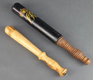 A reproduction Victorian turned wooden police truncheon 39cm together with 1 other 30cm 