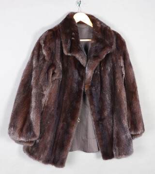 A lady's quarter length mink fur coat 