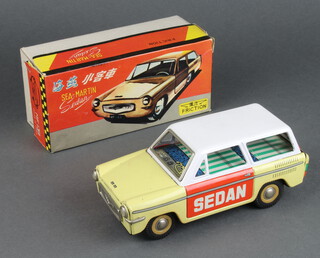 A Chinese tinplate Sea-Martin sedan friction car MF139 in cream and orange, boxed