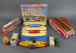 A Mar tinplate Speed Cop set boxed, a Mettoy railway bridge boxed, a Sparking Super Chief Express 721 boxed, an S Wells & Co Walking Clown 9/148 boxed, a Minic Ford Saloon boxed and a clockwork model paddle steamer 