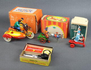 A Soviet Russian tinplate clockwork motorcycle and sidecar boxed, ditto man and cart together with a scooter rider boxed 
