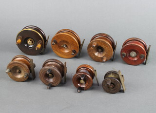 A mahogany and brass centrepin starback fishing reel 3 1/2", a centrepin ditto 3 1/2" and 6 others (2 x 3", 2 x 2" and 2 x 1 1/5") 
