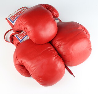 Three boxing gloves, all signed Henry Cooper 