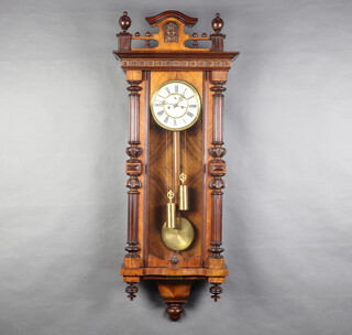 A 19th Century Vienna style striking regulator with 18cm enamelled dial having a subsidiary second hand, Roman numerals and wooden pendulum, contained in a walnut case, complete with key, pendulum and 2 weights