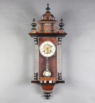 A Vienna style striking regulator with 14cm gilt and porcelain dial, Roman numerals and gridiron pendulum, contained in a walnut case complete with key 80cm h x 29cm w x 15cm d  