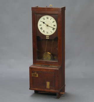 Gledhill-Brook, an electric time recorder, the 25cm dial marked The Gledhill-Brook Time Records Ltd, Patent Electrically Propelled, contained in an oak case 115cm h x 39cm w x 30cm d 
