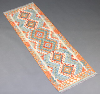 A turquoise, yellow and white ground Chobi Kilim runner with 6 diamonds to the centre 184cm x 62cm 