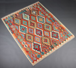 A white, tan and blue ground Chobi Kilim rug with all over geometric design 202cm x 154cm 