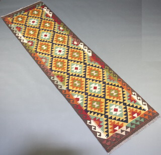 A green, brown and black ground Maimana Kilim runner with all over geometric design 290cm x 80cm 