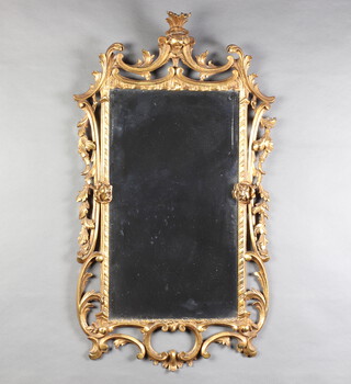 A Rococo style rectangular plate wall mirror contained in a carved gilt wood frame 92cm x 50cm 