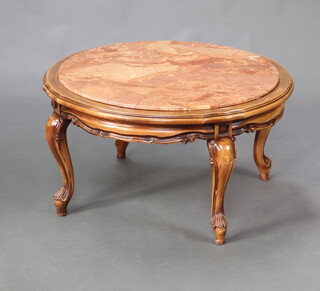 A circular walnut coffee table with inset ink veined marble top, raised on cabriole supports 43cm h x 80cm diam. 