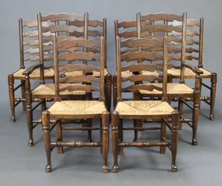 A set of 8 elm ladder back dining chairs with woven rush seats on turned supports comprising 2 carvers 106cm h x 57cm w x 40cm d (seat 40cm x 33cm) and 6 standard chairs 106cm h x 54cm w x 48cm c (seat 35cm x 30cm)  
