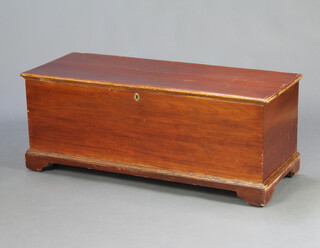 A 19th Century elm coffer with hinged lid, interior fitted a candle box, raised on bracket feet 49cm h x 126cm w x 51cm d 