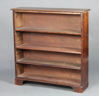 A Victorian mahogany open bookcase fitted adjustable shelves, raised on bracket feet 109cm h x 106cm w x 28cm d 