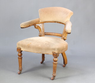 A Victorian light oak show frame tub back chair upholstered in mushroom material, raised on turned supports 84cm h x 60cm w x 57cm d (seat 40cm x 42cm) 