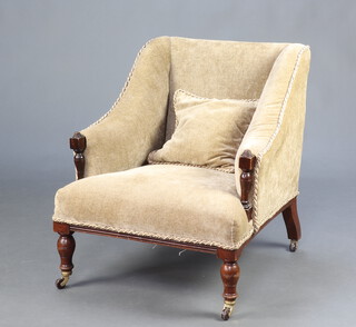 An Edwardian armchair upholstered in mushroom material, raised on turned supports 76cm h x 67cm w x 70cm d (seat 37cm x 46cm) 