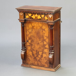An inlaid mahogany cabinet with moulded and dentil cornice, fitted shelves enclosed by panelled door and with turned columns to the side 67cm h x 45cm w x 22cm d (possibly formed from a longcase clock trunk) 
