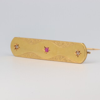 A Victorian yellow metal ruby and diamond set bar brooch 6.3 grams