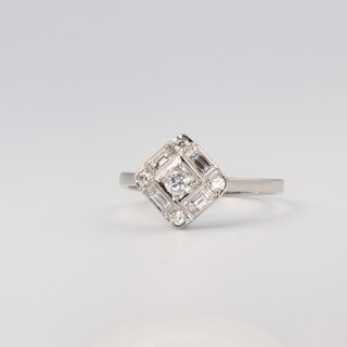 A platinum brilliant and baguette cut diamond ring 0.5ct, 3.6 grams, size N 1/2 
