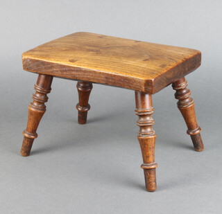 A 19th Century rectangular elm stool raised on turned supports 19cm h x 25cm w x 17cm d 