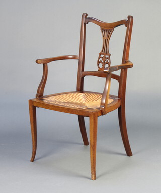 An Edwardian mahogany slat back open armchair with woven rush seat raised on outswept supports 91cm h x 53cm w x 45cm d (seat 43cm x 34cm) 