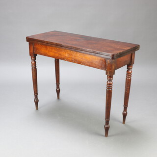 A Georgian mahogany D shaped tea table, raised on turned supports 74cm h x 97cm w x 42cm d 