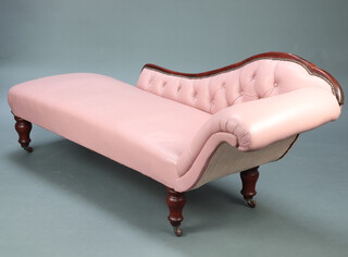 A Victorian mahogany framed chaise longue upholstered in pink buttoned leather 76cm h x 200cm w x 70cm d  