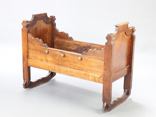 A Victorian oak rocking cradle of panelled form, 81cm h x 106cm l x 50cm w