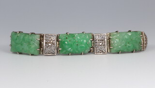 A white metal and 3 plaque carved green hardstone Art Deco bracelet, 16cm 