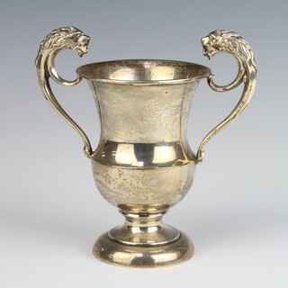 A silver two handled trophy cup with lion handles Birmingham 1925, 12cm, 174 grams